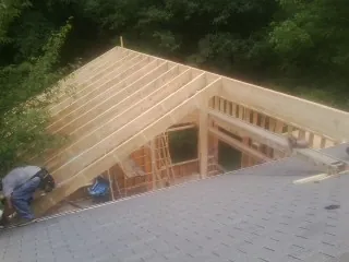 Framing a new roof addition that ties into an existing shingle roof in Warsaw